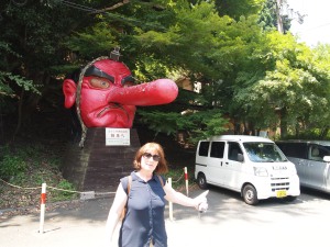 My mother in front of the tengu of Kurama Station